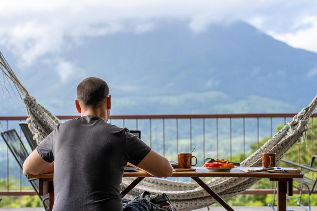 young man working abroad exemplifying digital nomadism