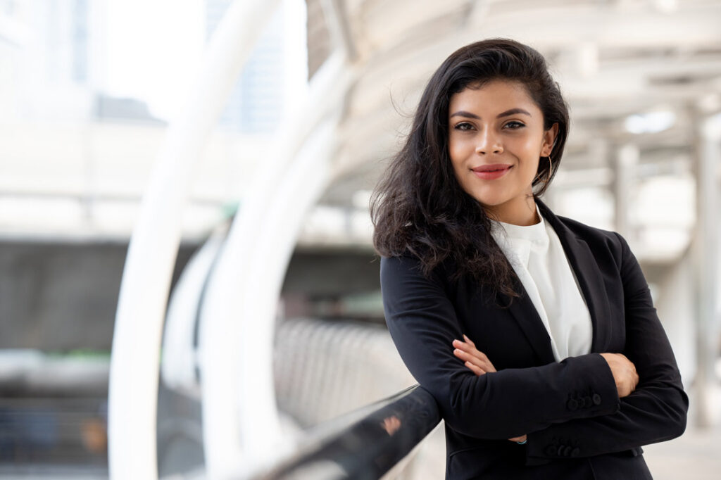 Young Latina executive explaining how to get into the c-suite