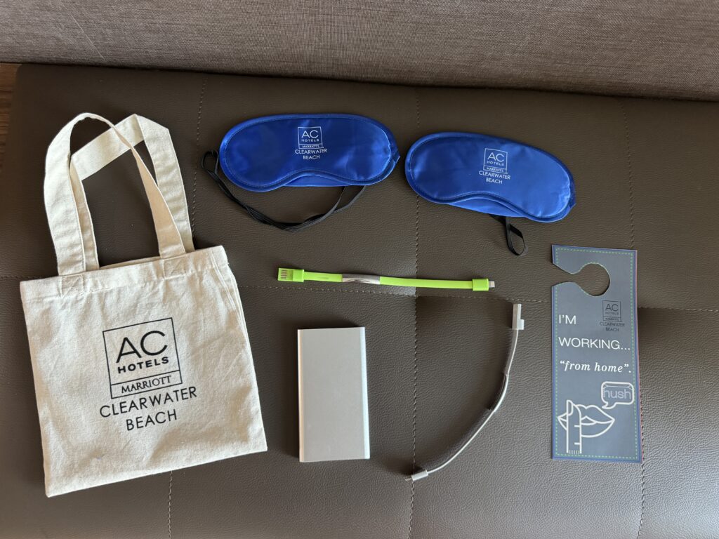 'I'm working from home' hotel tag and other amenities laid out on couch