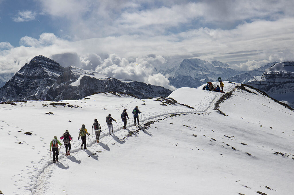 group of people hiking in the snow