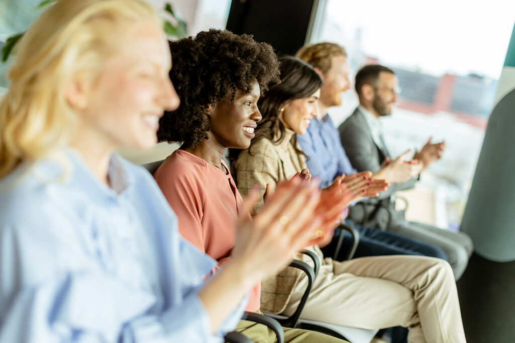 group of employees clapping