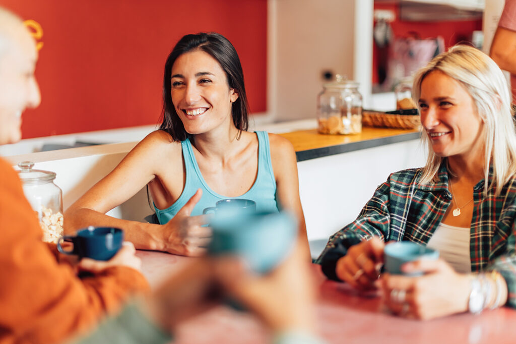 group of friends having coffee in a co-living space