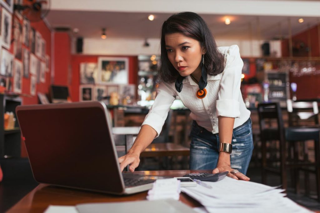 woman working to prevent business from failing